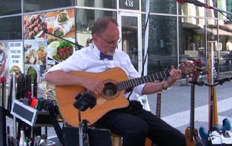 Dan Playing Accoustic Guitar